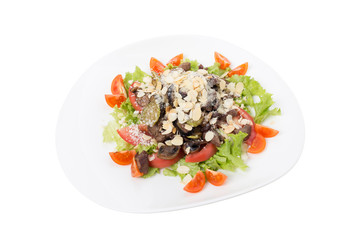 Warm meat salad with vegetables and almonds.