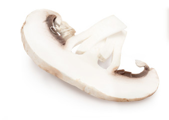Sliced mushroom (champignon, cut foot, Agaricus Bisporus) and raw. Isolated on white background
