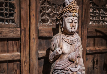 Buddha statue in China. Wooden statue