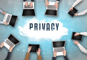 Group of people having a meeting with PRIVACY insciption, web security concept