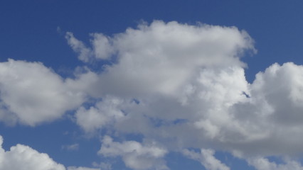 white fluffy clouds on a blue sky