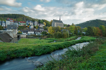 View of Old Beyenburg in autumn colors during a cloudy morning.