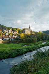 Fototapeta na wymiar View of Old Beyenburg in autumn colors during a cloudy morning.