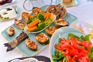 appetizers with yogurt, tomatoes, cheese, lemon, greens, mussels, olives, snacks on white background, ready for service, should be used as background.