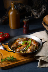Homemade white sausage fried with onion and herbs