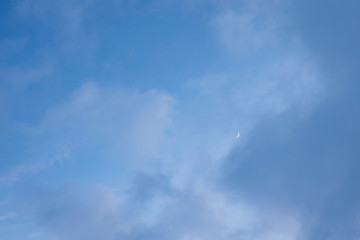 light beautiful clouds on blue sky. Soft background and texture