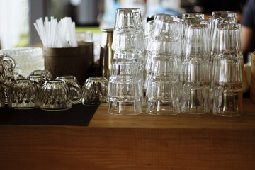 empty clean glasses on a bar counter in a cafe, pandemic, isolation, quarantine