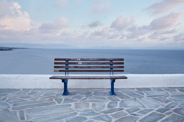 Wooden bench in front of the sea
