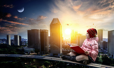 Little girl reading a book
