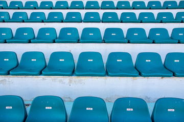 Front view of green bench or chair in the stadium.