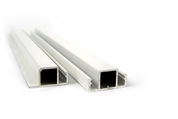 Cut aluminium profiles on a white background