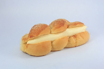 Delicious bread topped with sugar on a white background