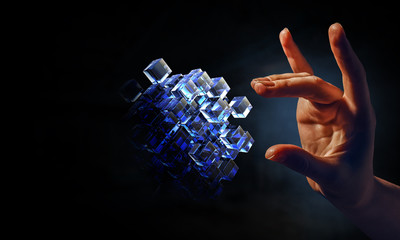 Hand holding glowing cubes. Innovation and creativity concept.