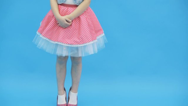 4k video where cute pretty little girl in high heels wearing big mother's shoes.
