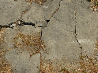 Cracked concrete texture closeup background