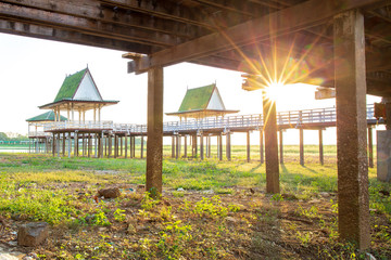 Dry or arid lake and old vintage pavilion with sunset light on the evening at Phichit, Thailand, Asia.