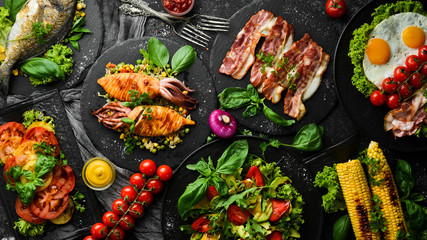 Food. Set of dishes on the table. Dishes of meat, fish and vegetables. Top view.