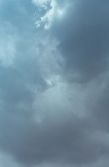 Fototapeta premium Fluffy clouds cover the summer blue sky