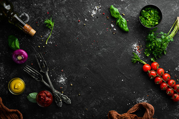 Food background. Vegetables, spices and kitchen utensils on the old table. Free copy space.