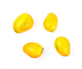 Ripe mango on white background. Tropical fruit. Top view of yellow mango. High angle view of fresh mangoes