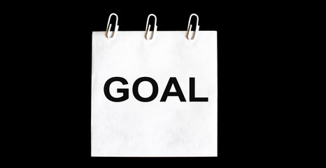 White stickers Goal on black background