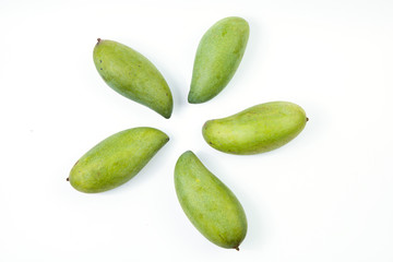 Fresh green mango on white background. Top view of keaw sawaei mango. High angle view of mangoes. Tropical fruit.
