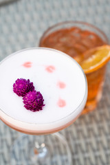 Cocktail with globe amaranth flower