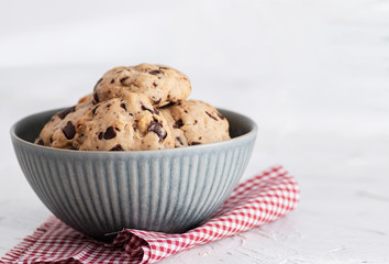 Homemade cookies with chocolate chips in bowl.