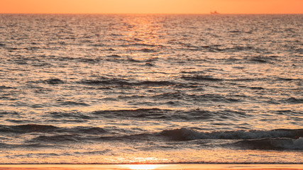 Sea Water Surface At Sunset. Natural Sunrise Warm Colors Of Ocean