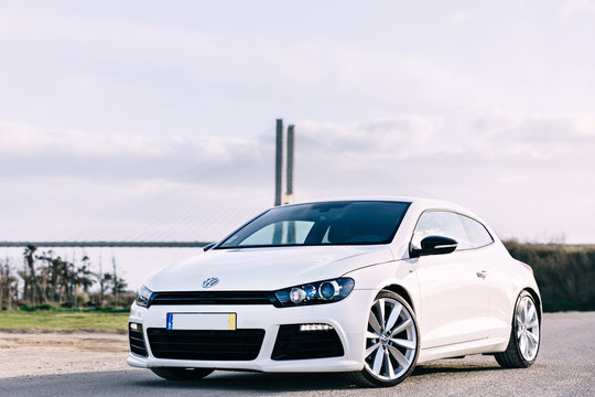 Modern design white hatchback on the background of the bridge. v