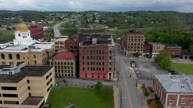 Trucking shot to the left showing the town and then revealing the Marion County courthouse in Fairmont, WV.