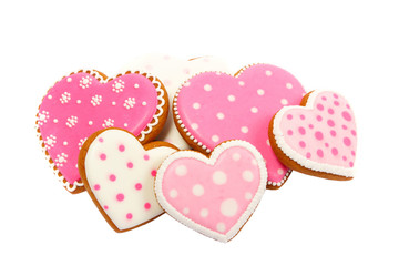 background from pink cookies heart shaped with different patterns, isolated on the white