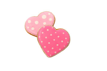 background from pink cookies heart shaped with different patterns, isolated on the white