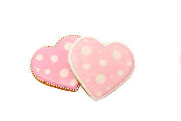 background from pink cookies heart shaped with different patterns, isolated