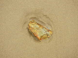 stone on sand beach