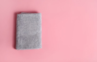 Bath towel on pink background