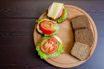 sandwiches with vegetables, cheese and meat close-up