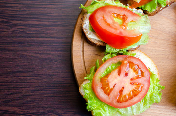 sandwiches with vegetables, cheese and meat close-up