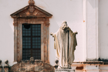 Old Goa, India. Cathedral Of St. Paul And Statue Of Jesus In Sunny Day