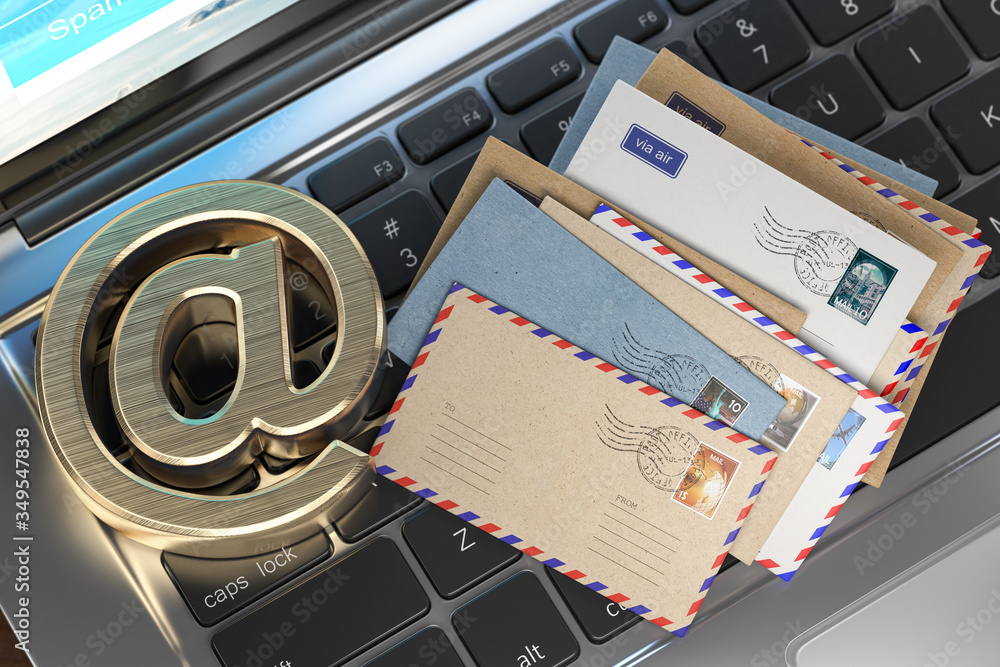 Poster email sign and letters on laptop keyboard. e-mail concept.