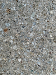 Grunge or rocky background.  Stone texture. Rocks embedded in cement. Construction, architecture or pavement.