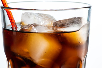 cocktail with ice and cola in a glass on a white background, you can add rum or whiskey