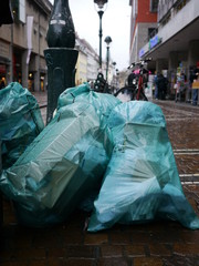 lot of filled bin liner street