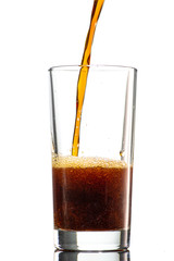 pour a dark drink in the mill on a white background, similar to cola, kvass, tea, dark beer