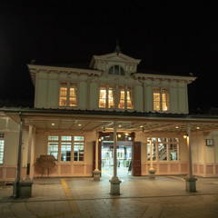 Medieval train station building with warm color light at night scene for background with copy space , Nikko