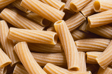 wholemeal whole-grain Italian pasta background 