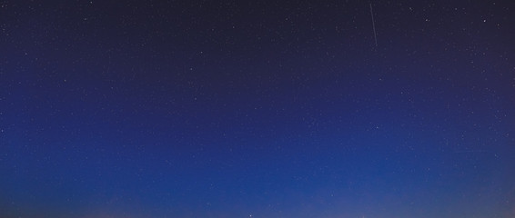 Fototapeta na wymiar Real Night Sky Stars. Natural Starry Sky Blue Background Backdrop