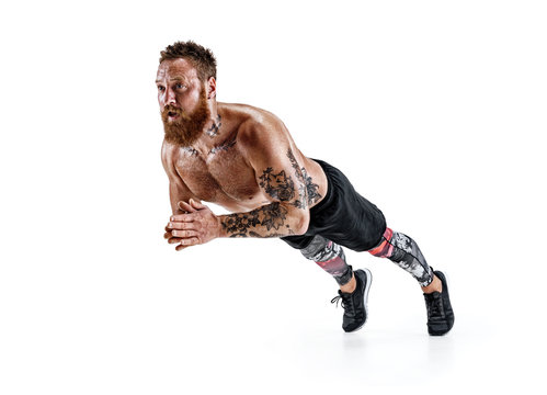 Strong man doing push ups with clap. Photo of sporty man doing exercising isolated on white background. Strength and motivation