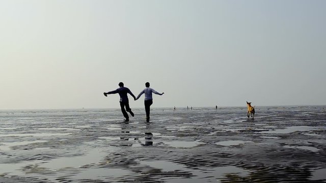 father and son on beach