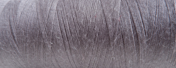 Sewing accessories. Texture of  gray thread. Suitable for advertising background